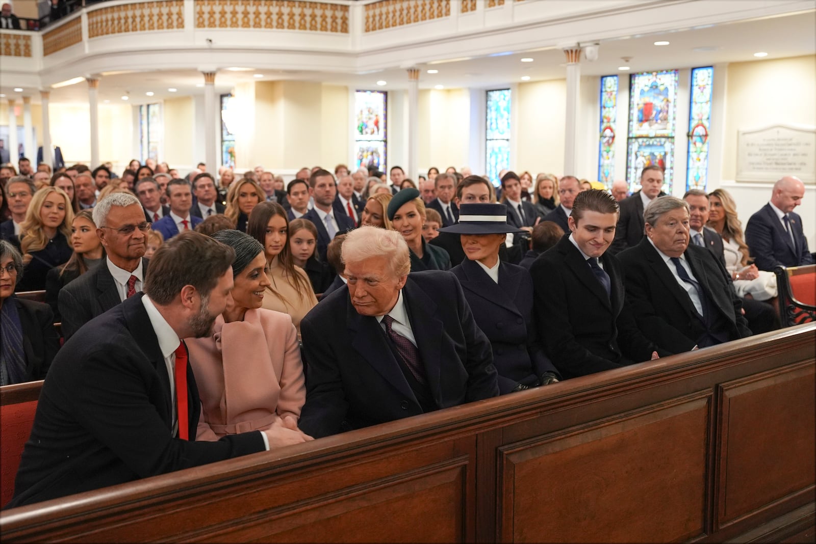 President-elect Donald Trump shakes hands with Vice President-elect JD Vance as Usha Vance watches as he arrives for a service at St. John's Church, Monday, Jan. 20, 2025, in Washington, ahead of the 60th Presidential Inauguration. (AP Photo/Evan Vucci)