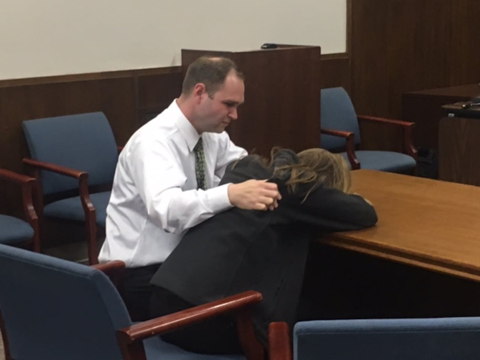 Jessica Langford is consoled Friday by her husband Matthew after a jury found her guilty of three counts of sexual battery and three counts of unlawful sexual contact with a minor. A 15-year-old testified last week he had sex with Langford in the Miamisburg Middle School teacher’s classroom on May 23, 2017. NICK BLIZZARD/STAFF