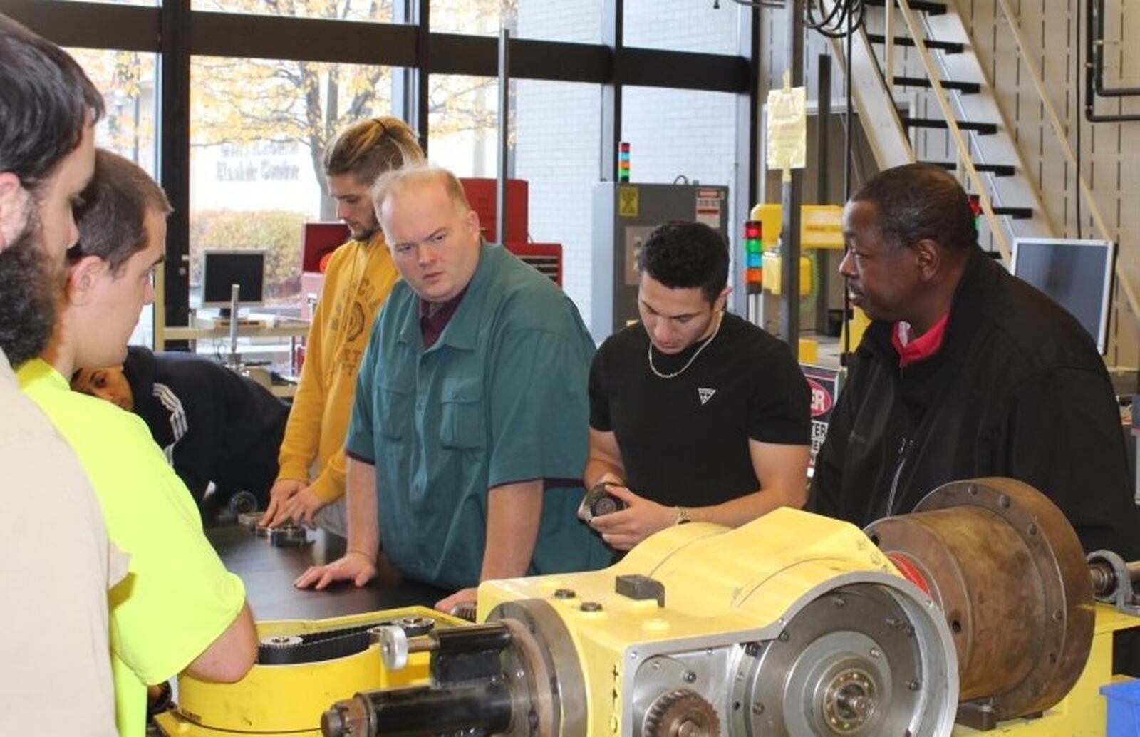 David Blubaugh (green shirt) has put his job search on hold indefinitely. The 36-year-old former U.S. Defense Department engineer said he could probably find a job if he had to, but he s reluctant to settle for a job with lower pay and fewer benefits than what he once earned. RANDY TUCKER