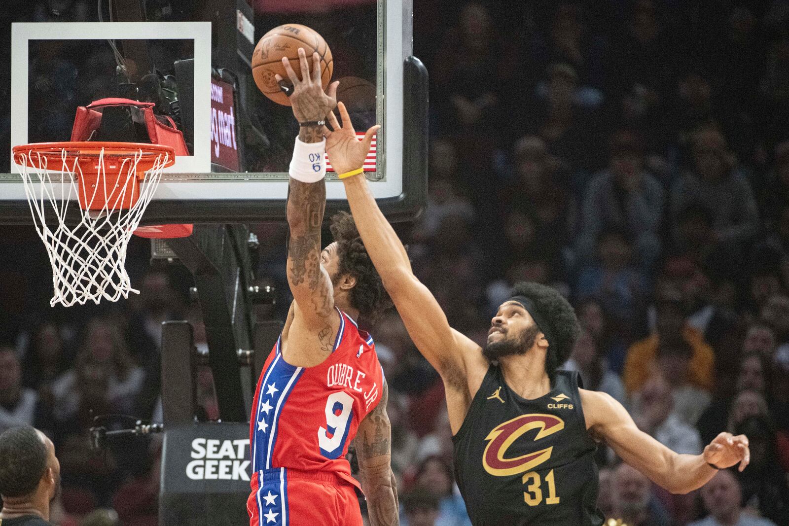 Philadelphia 76ers' Kelly Oubre Jr. (9) shoots over Cleveland Cavaliers' Jarrett Allen (31)during the first half of an NBA basketball game in Cleveland, Saturday Dec. 21, 2024. (AP Photo/Phil Long)