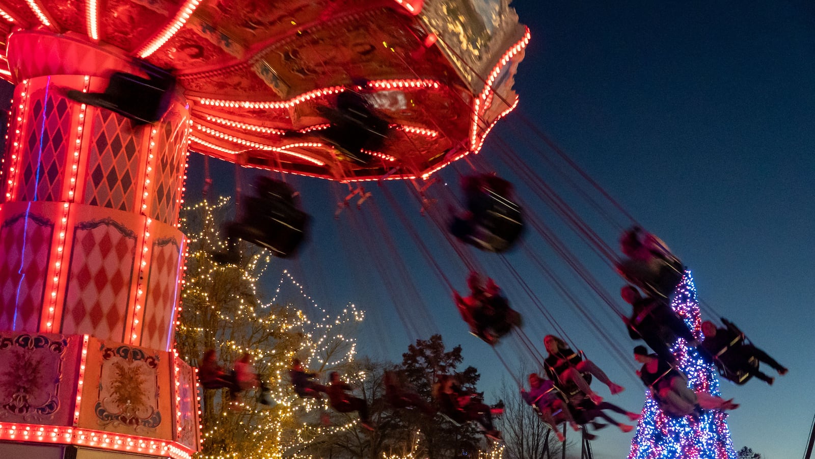 Kings Island WinterFest 2022 has 20 rides open, just as many live entertainment shows, crafts for kids, a sledding hill, ice skating and more. The Eiffel Tower is lit as a giant Christmas tree and there is a nightly holiday parade. WinterFest is open on select nights through the end of December. PHOTOS: KINGS ISLAND/CONTRIBUTED