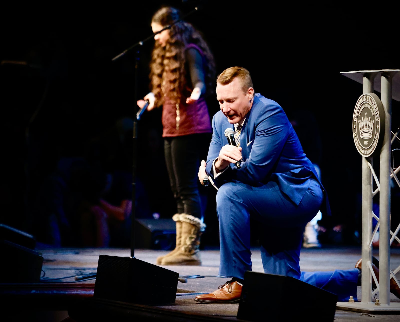 Cedarville University President Thomas White kneels in prayer during a service for Grace Maxwell, Friday, January 31, 2025. MARSHALL GORBY/STAFF