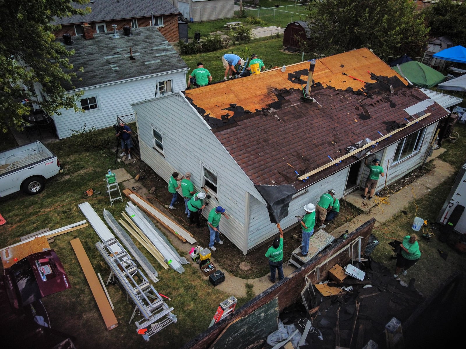 Tornado recovery was fast for some, and slow for others. Here, volunteers from Shiloh Church and corporate partners reroof a house on Oneida Avenue in Harrison Twp. in September 2021, more than two years after the Memorial Day tornados. JIM NOELKER/STAFF