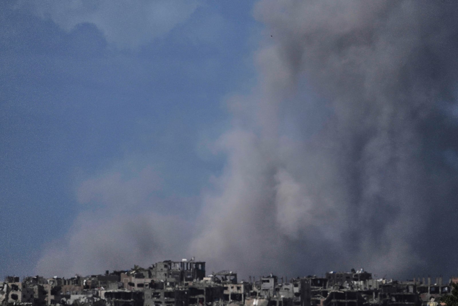 Smoke rises following an Israeli bombardment in the Gaza Strip, as seen from southern Israel, Wednesday, March 19, 2025. (AP Photo/Ariel Schalit)