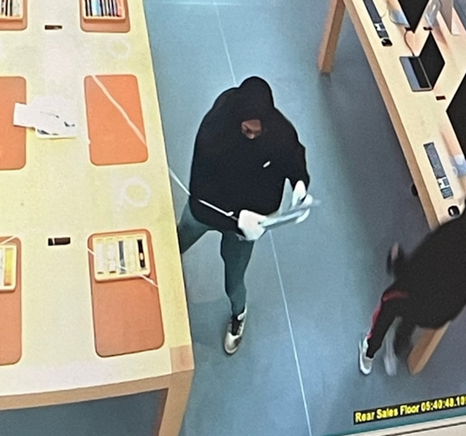 Beavercreek police are working to identify three people reportedly stole more than $100,000 worth of items from the Apple store at The Greene on Monday, Jan. 23, 2023. Photo courtesy the Beavercreek Police Department.