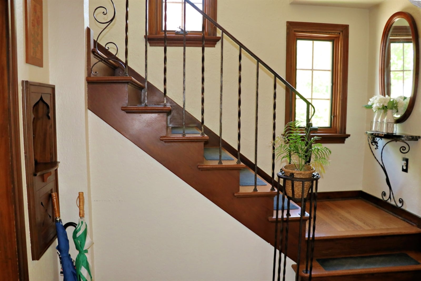 Many of the home's original details have been restored or enhanced, including a wood-carved telephone booth.