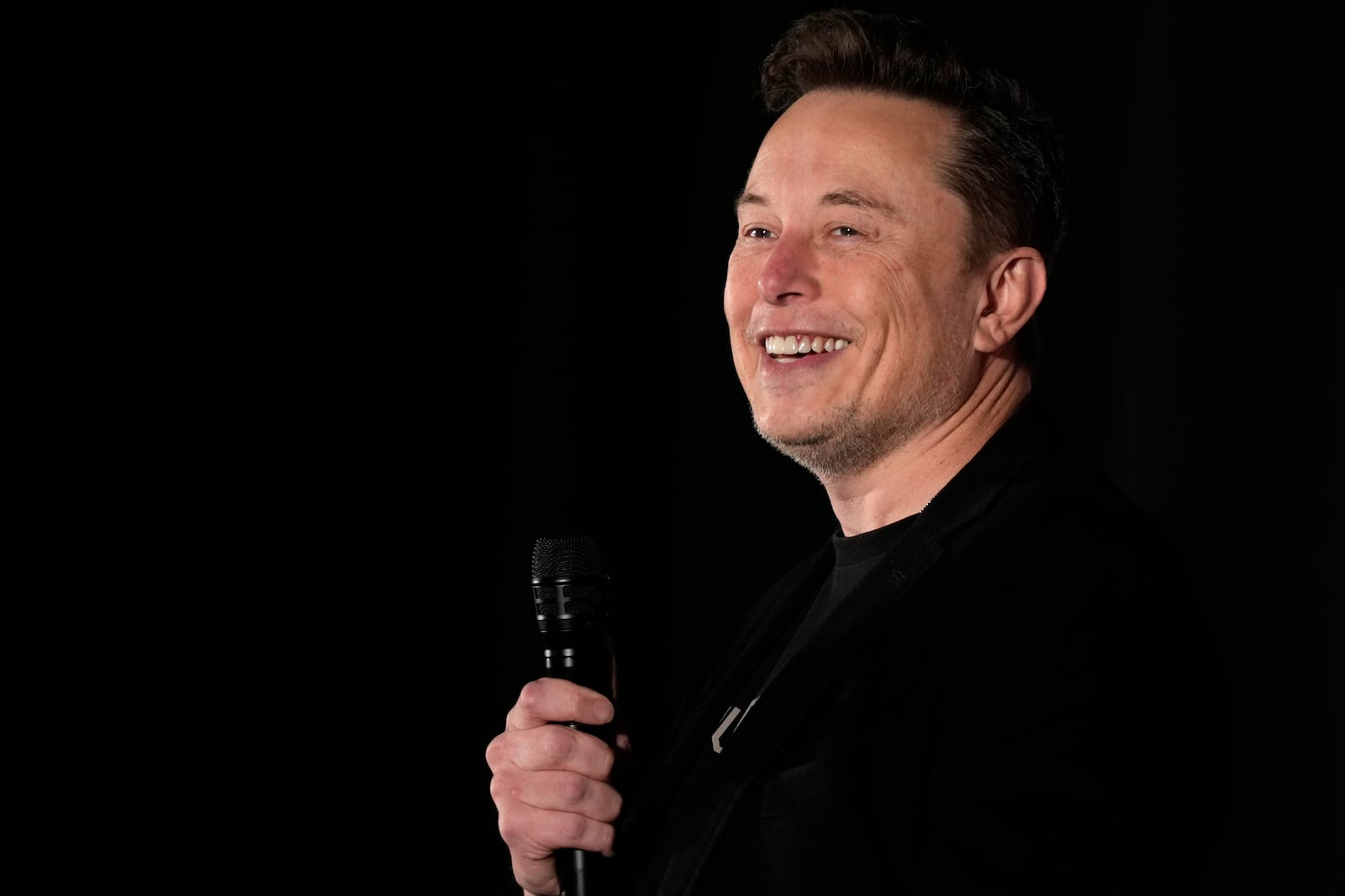 FILE - Elon Musk speaks as part of a campaign town hall in support of Republican presidential nominee former President Donald Trump in Folsom, Pa., Thursday, Oct. 17, 2024. (AP Photo/Matt Rourke, File)