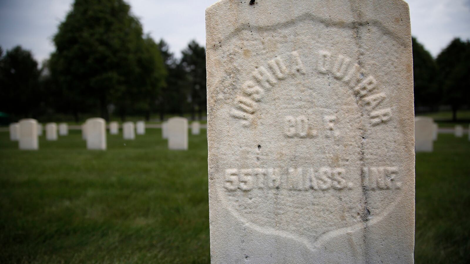 Gravesite of U.S. Army Pvt. Joshua Dunbar, father of poet Paul Lawrence Dunbar, in the Dayton National Cemetery.   TY GREENLEES / STAFF