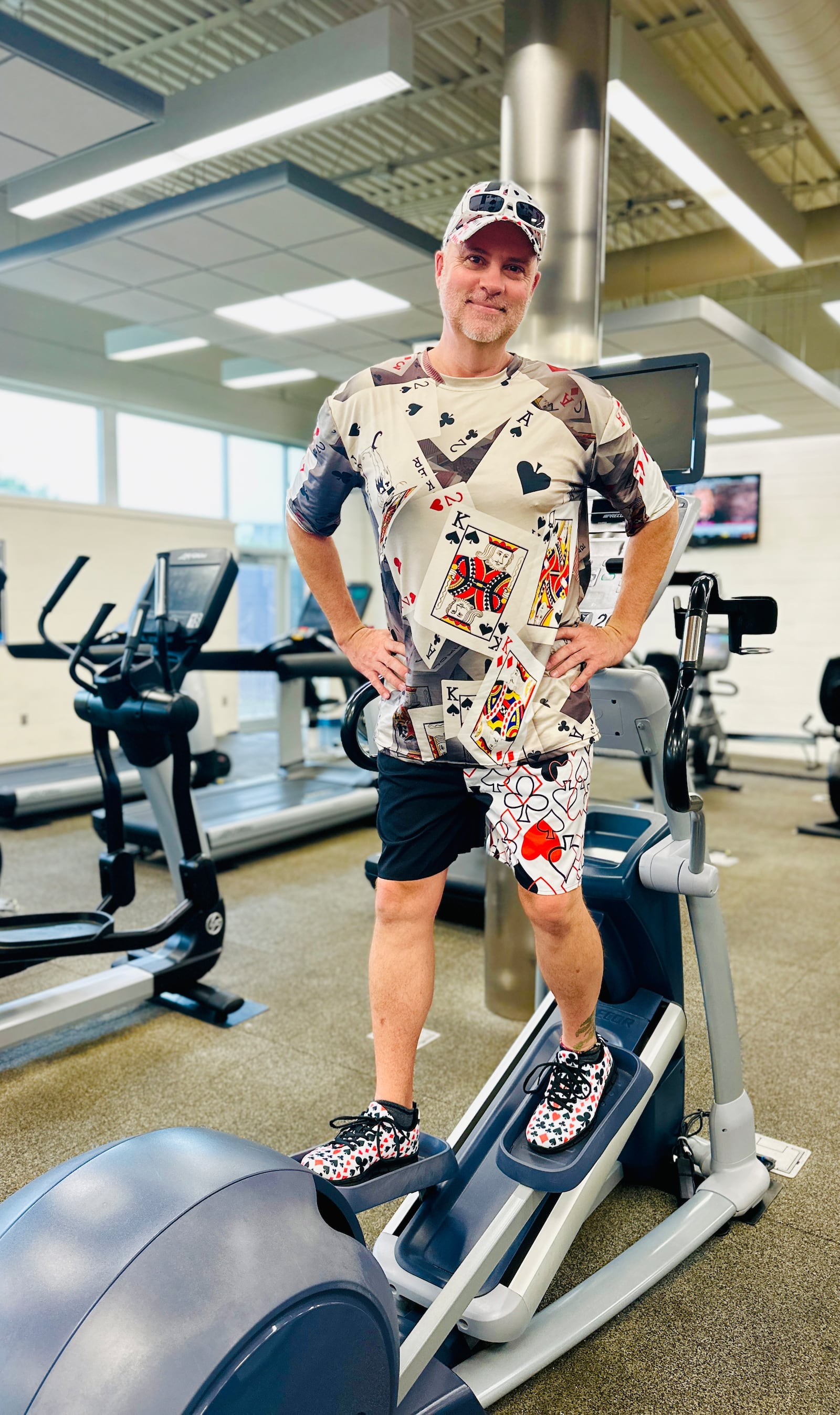 Jey Ellis wears his card-themed ensemble while working out. 