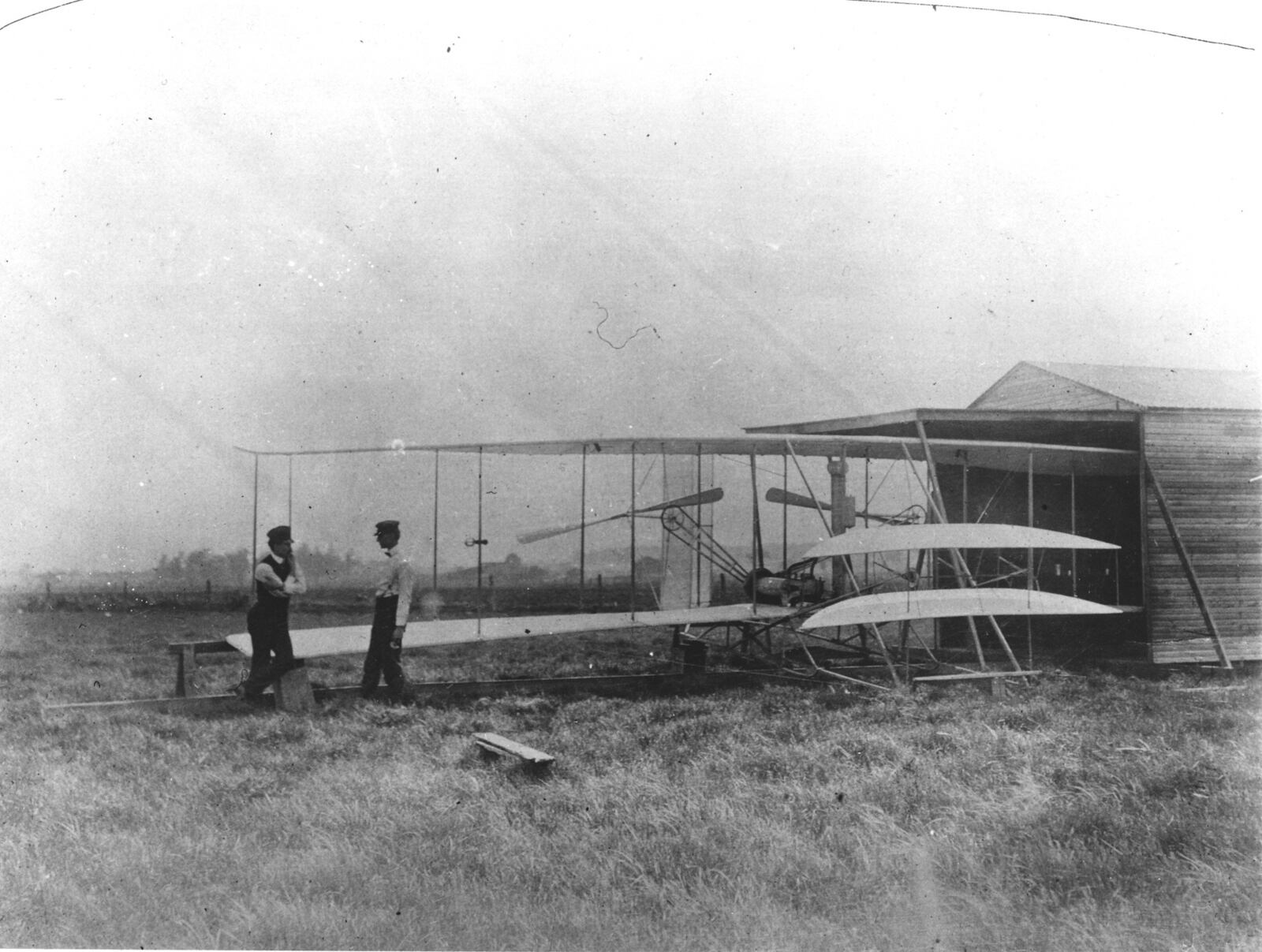 Orville, left, and Wilbur Wright at their hanger at Huffman Prairie in 1904.