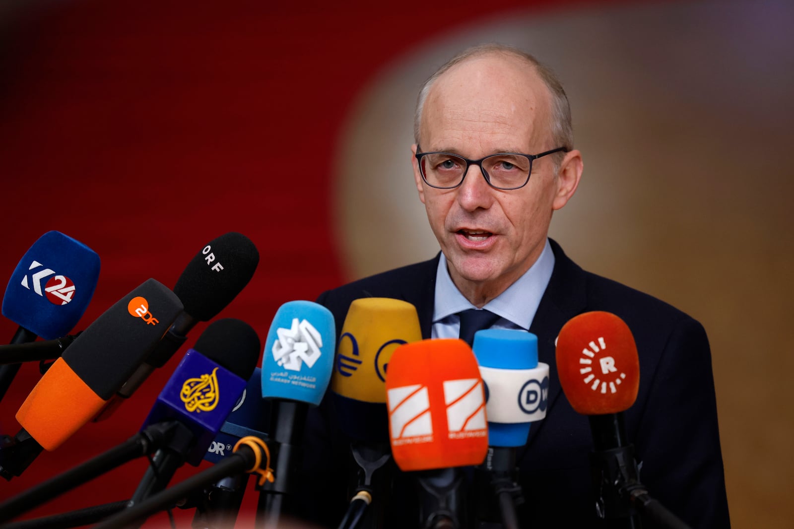 Luxembourg's Prime Minister Luc Frieden speaks with the media as he arrives for an EU summit at the European Council building in Brussels, Thursday, Dec. 19, 2024. (AP Photo/Geert Vanden Wijngaert)