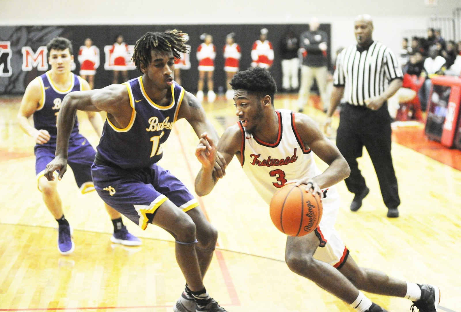 Sammy Anderson of Trotwood-Madison (with ball) drives on Butler defender Bryant Johnson. Trotwood defeated visiting Butler 94-76 in a boys high school basketball game on Friday, Jan. 11, 2019. MARC PENDLETON / STAFF