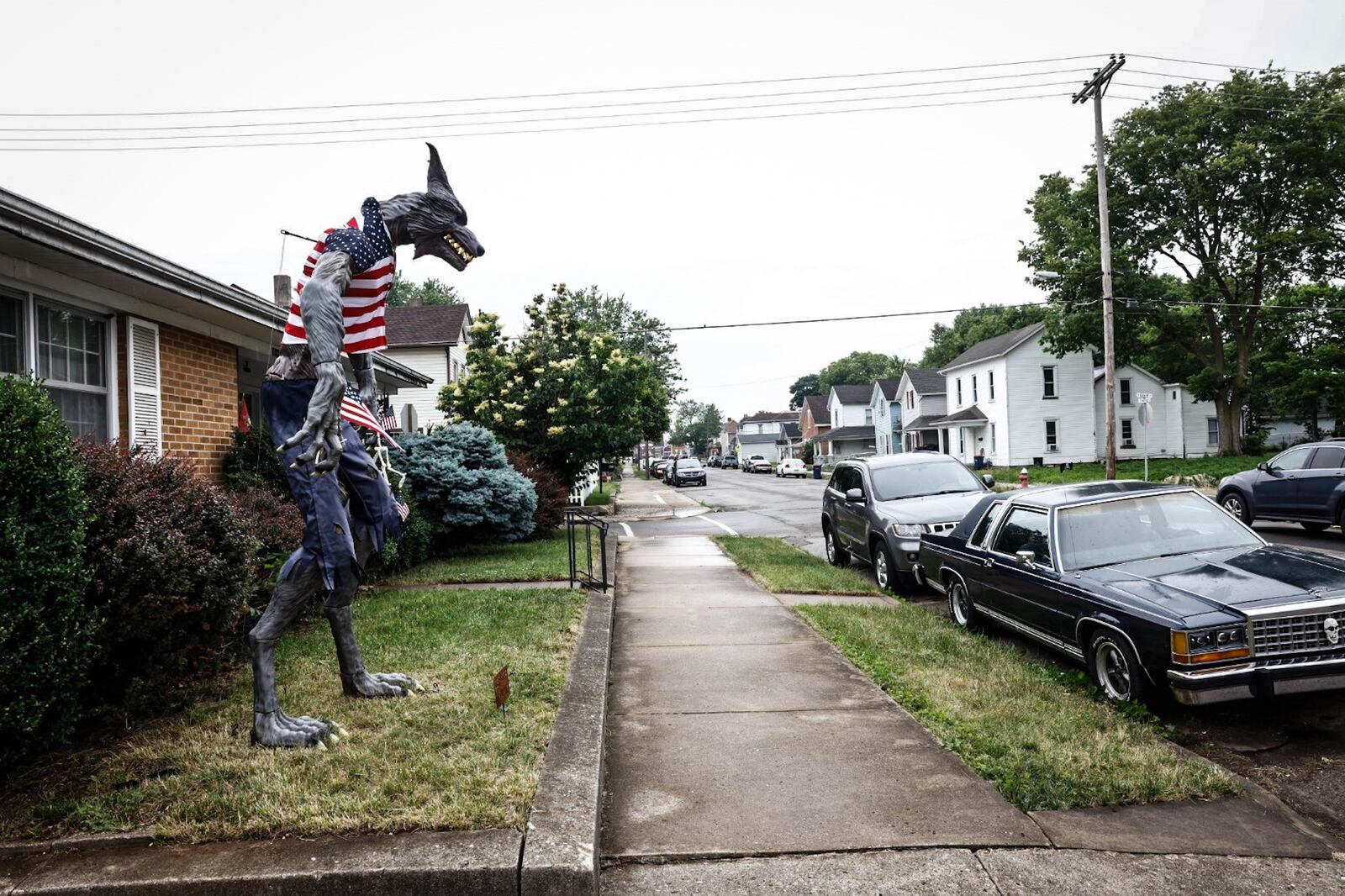 A 10-foot werewolf is in the front yard in Piqua at 500 South Downing Street. JIM NOELKER/STAFF