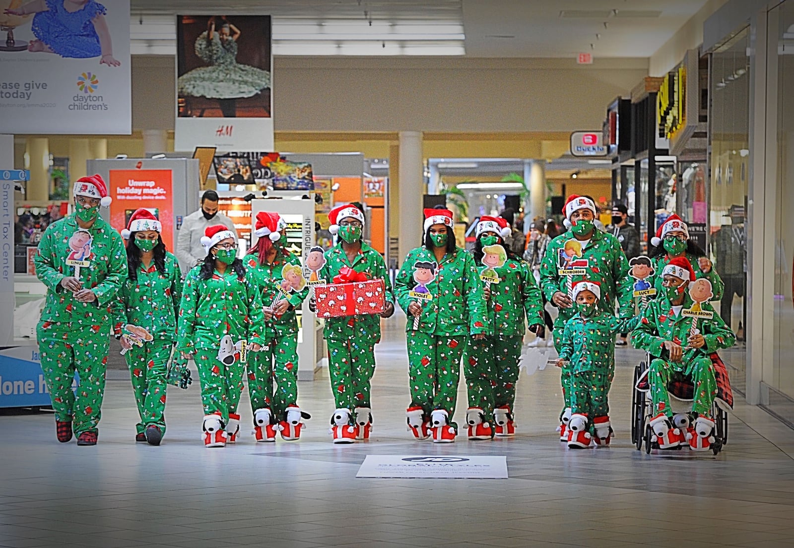 The Crosby family took their family tradition to the Dayton mall on Saturday, Dec. 19, 2020 to have a family photo taken in matching pajamas. This is a tradition that was started back in the 80's.
This year Cynthia Crosby chose A Charlie Brown Christmas. Crosby said they are truly, truly blessed and Merry Christmas. MARSHALL GORBY\STAFF