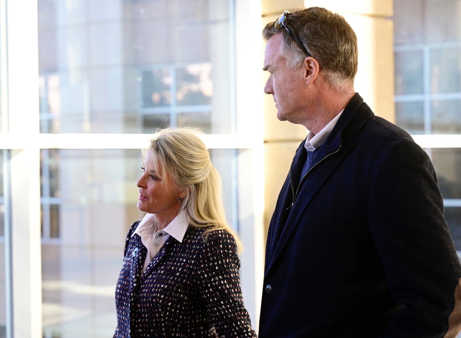 Tamara Dean Harney, left, and her husband, KC Harney, speak to the media at the Jefferson County Government Center after former Colorado Bureau of Investigation scientist Yvonne Woods' first court appearance Thursday, Jan. 23, 2025, in Golden, Colo. (Andy Cross/The Denver Post via AP)