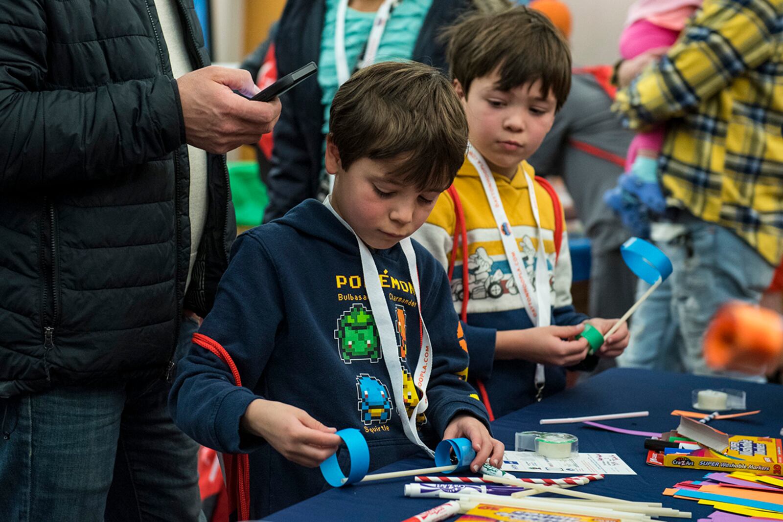 Two boys take part in a science experiment during the Big Hoopla STEM Challenge on March 13 at Dayton Convention Center. U.S. AIR FORCE PHOTO/JAIMA FOGG