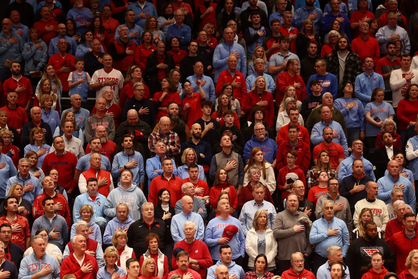 Dayton fans stand for the national anthem before a game against Marquette on Saturday, Dec. 14, 2024, at UD Arena. David Jablonski/Staff