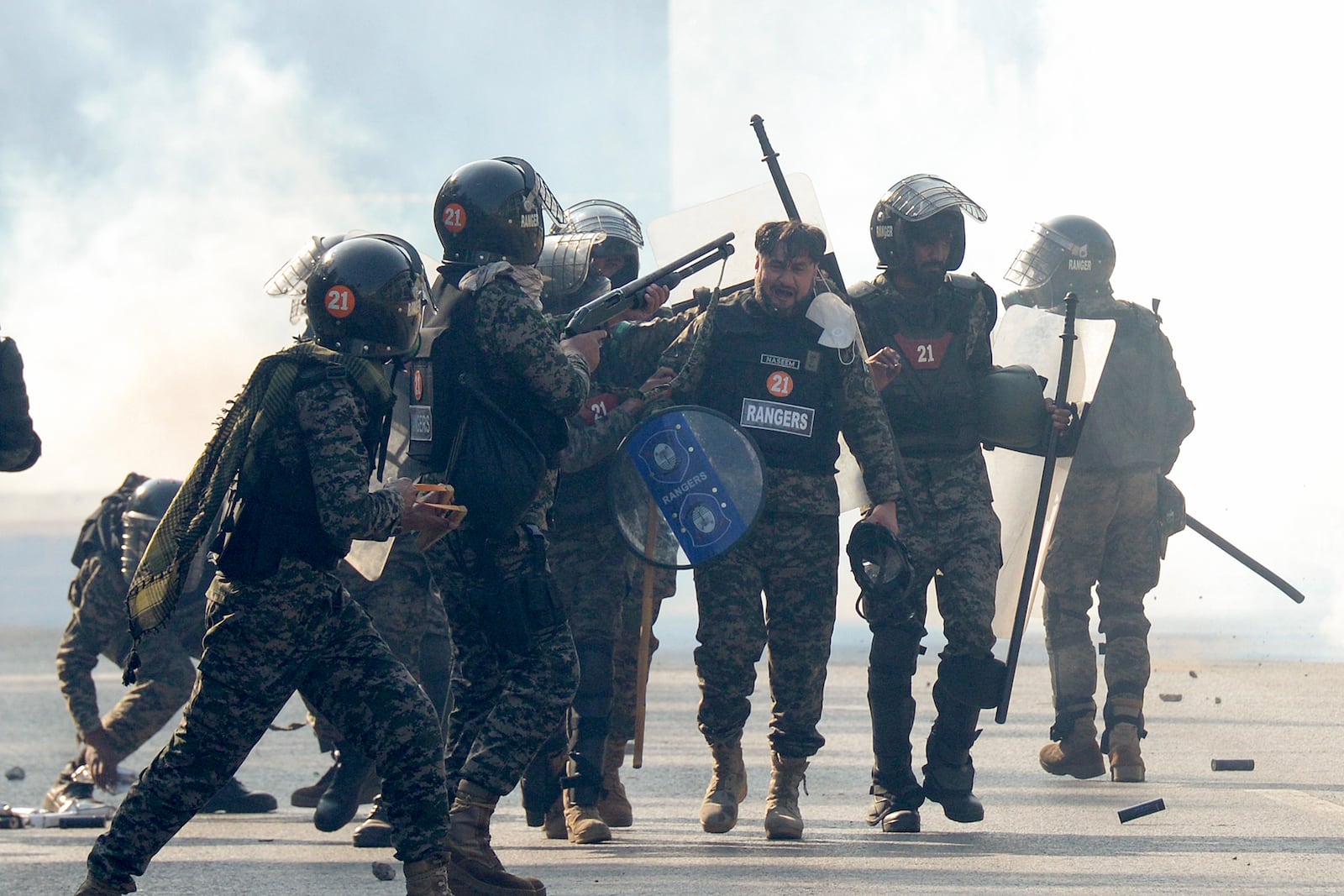 Paramilitary soldiers fire rubber bullets to disperse supporters of imprisoned former premier Imran Khan's Pakistan Tehreek-e-Insaf party, during clashes, in Islamabad, Pakistan, Tuesday, Nov. 26, 2024. (AP Photo/Irtisham Ahmed)