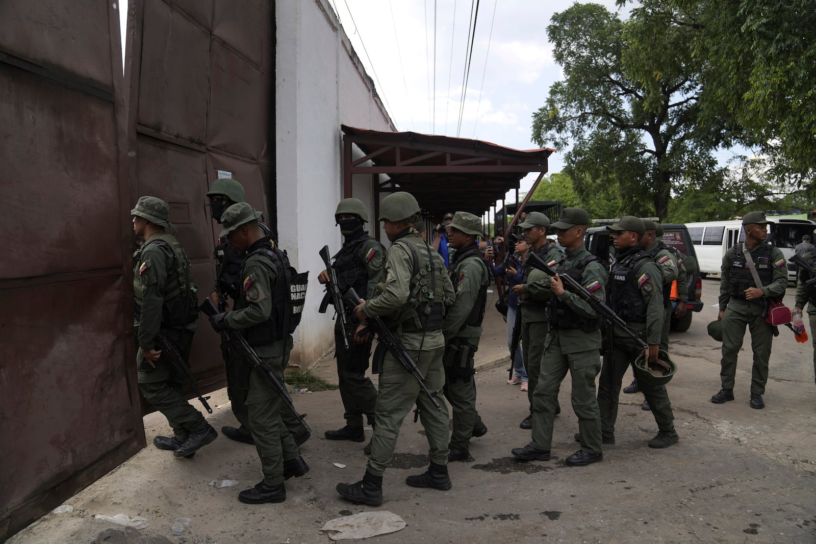 FILE - Soldiers raid the Tocorón Penitentiary Center, where the Tren de Aragua gang originated, in Tocorón, Venezuela, Sept. 20, 2023. (AP Photo/Ariana Cubillos, File)