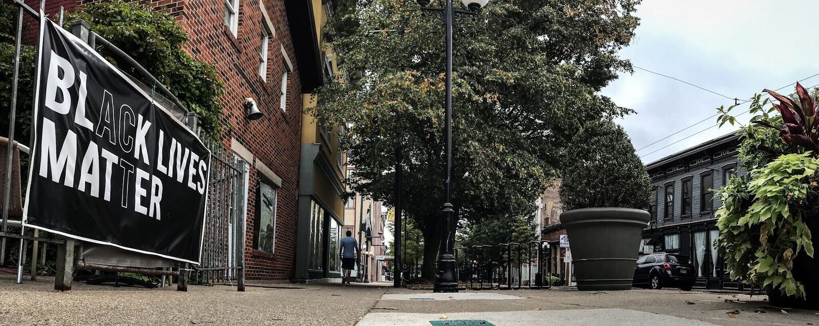 A handful of  Black Lives Matter signs remain on fences and building in the Oregon District in Dayton August 27, 2020.