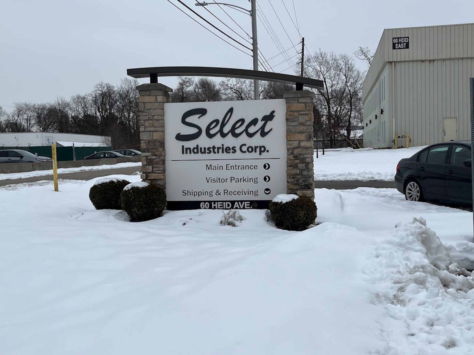 A sign at the visitors parking lot to Select Industries' 60 Heid Ave. plant on Jan. 14, 2025. THOMAS GNAU/STAFF