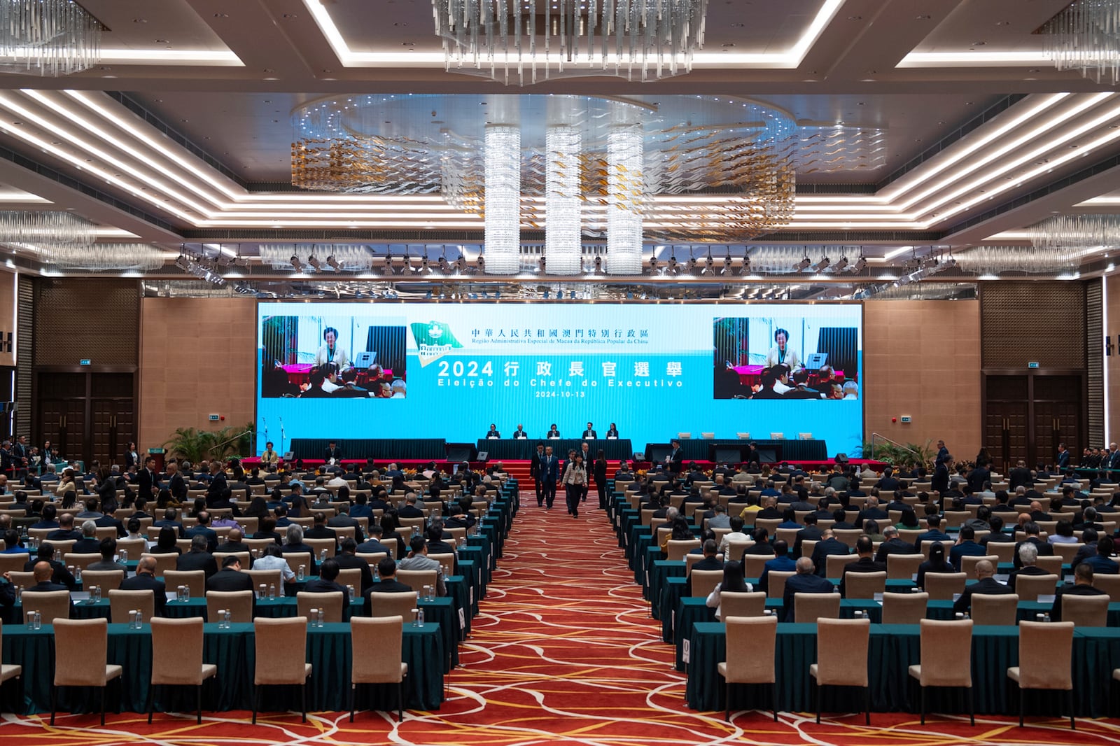 Election committee members vote during the chief executive election in Macao, Sunday, Oct. 13, 2024. (AP Photo/Bertha Wang)