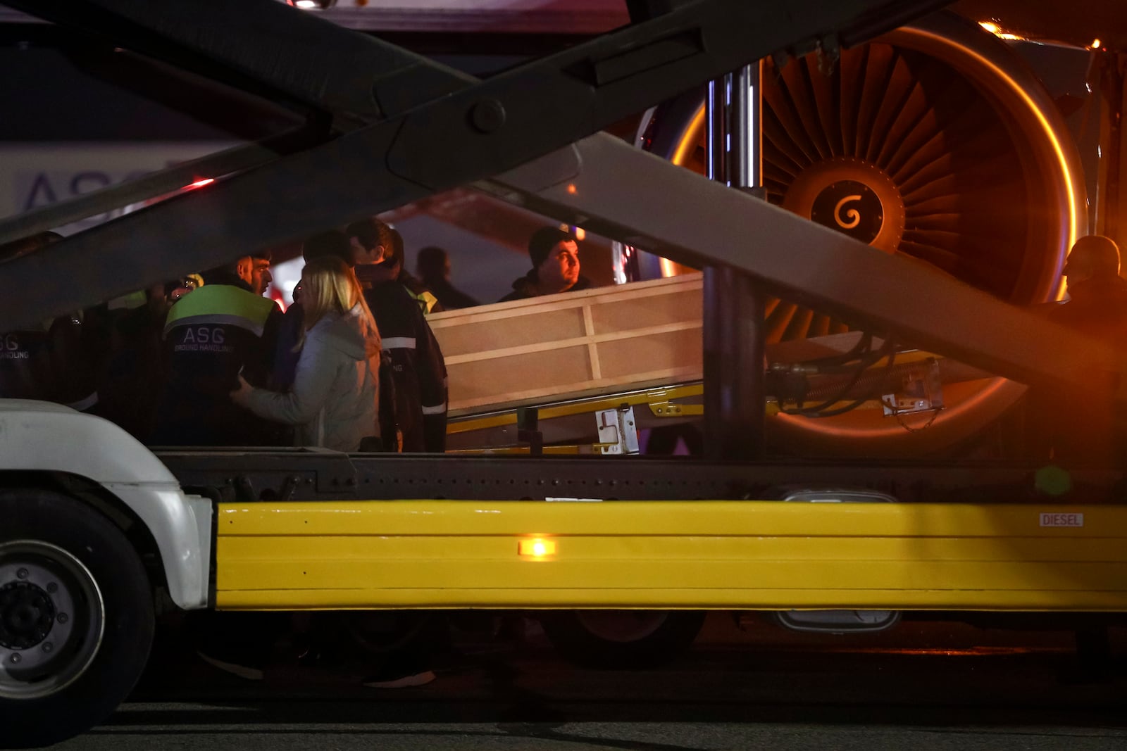 Workers carry a coffin with a body of a victim from a medical plane after the Azerbaijani Airline crashed, near the Kazakhstani city of Aktau, upon their arrival at the Heydar Aliyev International Airport outside Baku, Azerbaijan, Thursday, Dec. 26, 2024. (AP Photo)