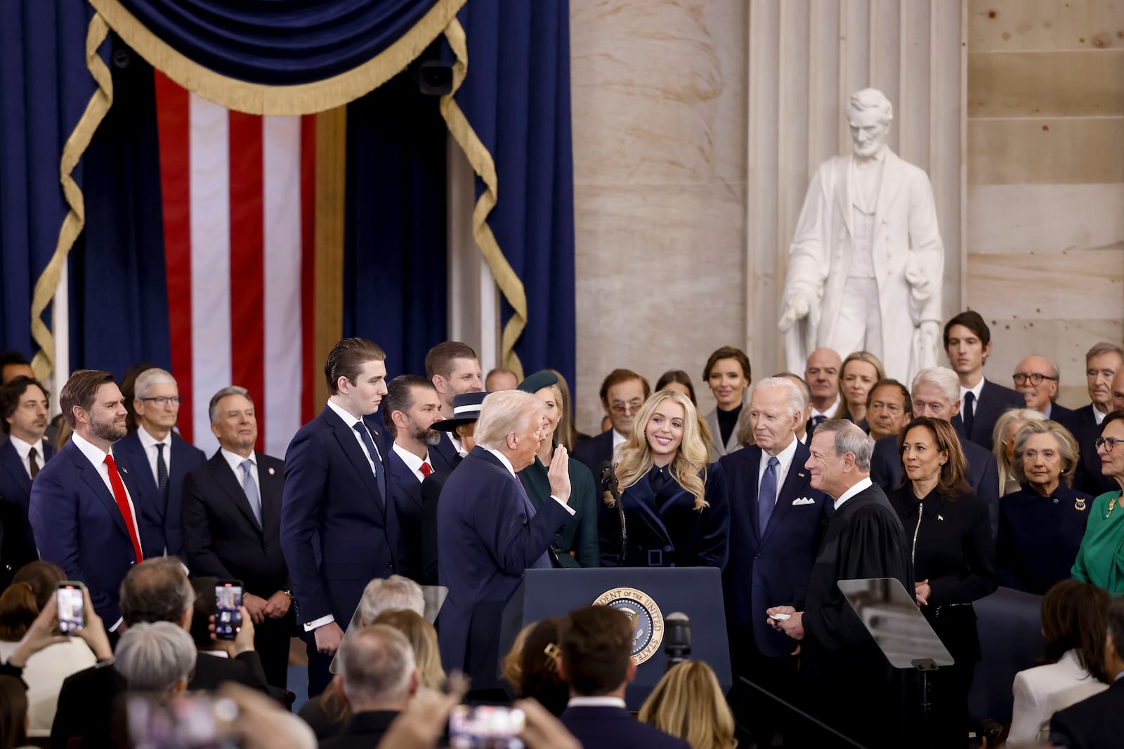 Supreme Court Chief Justice John Roberts, right, administers the presidential oath to President-elect Donald Trump, as President Joe Biden, right, looks on during the 60th Presidential Inauguration in the Rotunda of the U.S. Capitol in Washington, Monday, Jan. 20, 2025. (Shawn Thew/Pool photo via AP)