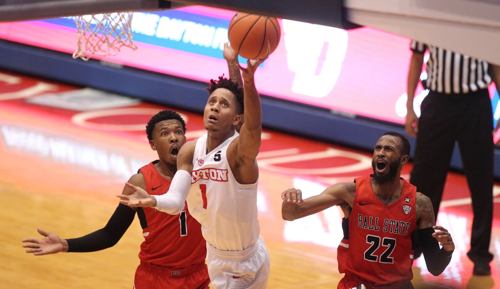 Flyers guard Darrell Davis shoots against Ball State at UD Arena in November. DAVID JABLONSKI / STAFF