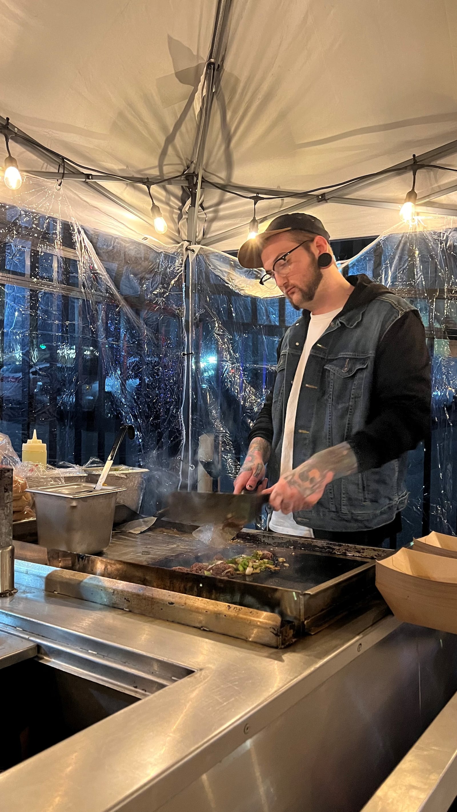 High Stakes, a new food cart serving feel-good American food, is operating Friday and Saturday nights on the back patio of Hole In The Wall in Dayton’s Oregon District. Pictured is owner Thomas Ebert (PHOTO CREDIT: JUSTIN FRITTS/FRITTACO).