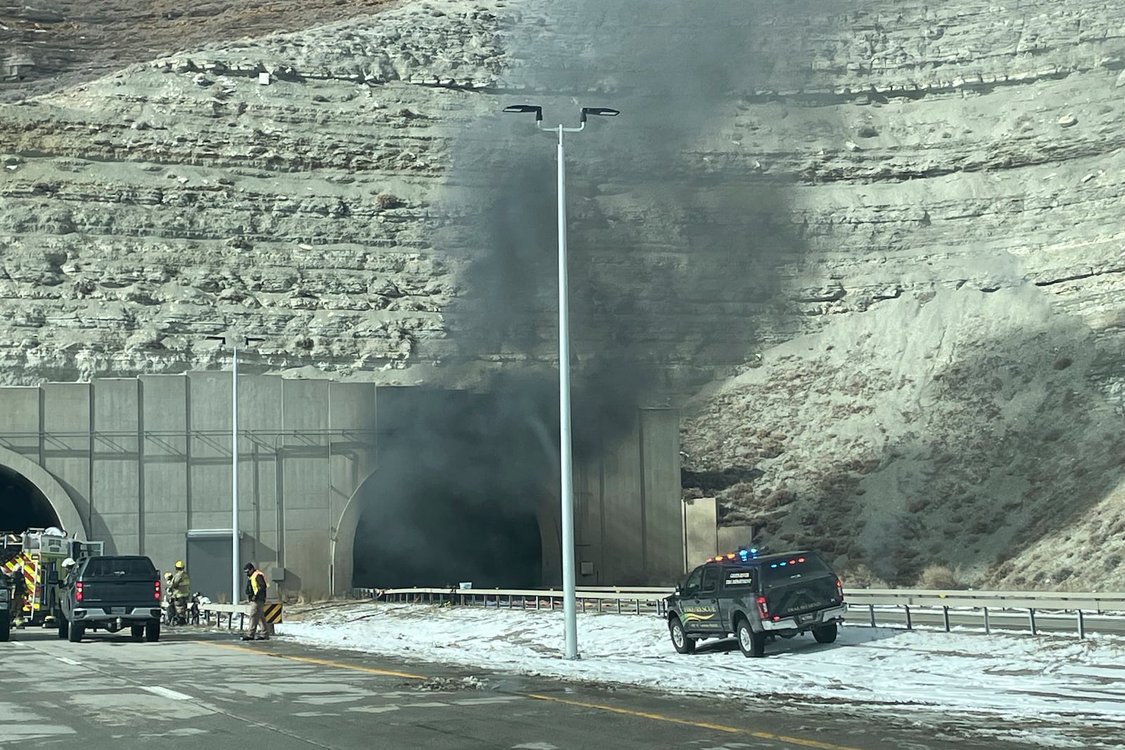 This photo provided by the Wyoming Highway Patrol shows smoke from a multiple-vehicle crash in the westbound tunnel of Interstate-80 in Green River, Wyo., on Friday, Feb. 14, 2025. (Wyoming Highway Patrol via AP)