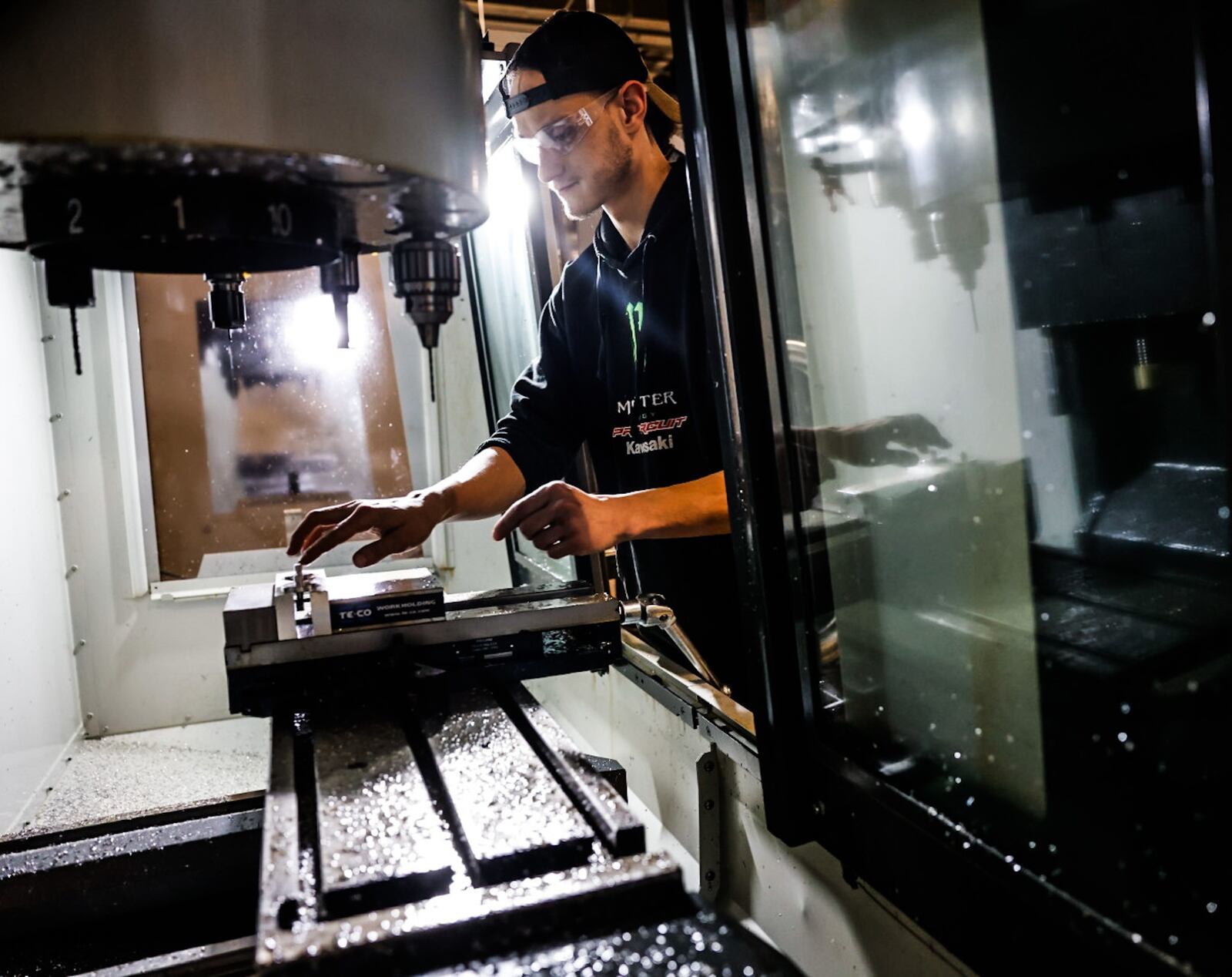 Sinclair College student John Davis operates a computerized mill during the DNC class. Davis is an employee at PFI Precision and is receiving advanced training at Sinclair. JIM NOELKER/STAFF