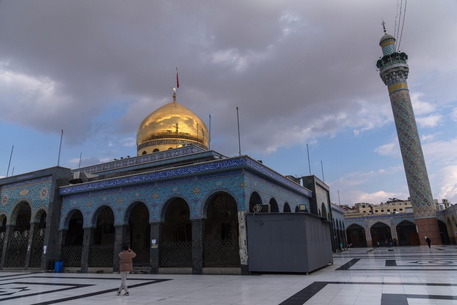 A man walks at the shrine of Sayyida Zaynab, the granddaughter of Prophet Mohammad, in Damascus, Syria, Saturday, Jan. 11, 2025. (AP Photo/Mosa'ab Elshamy)