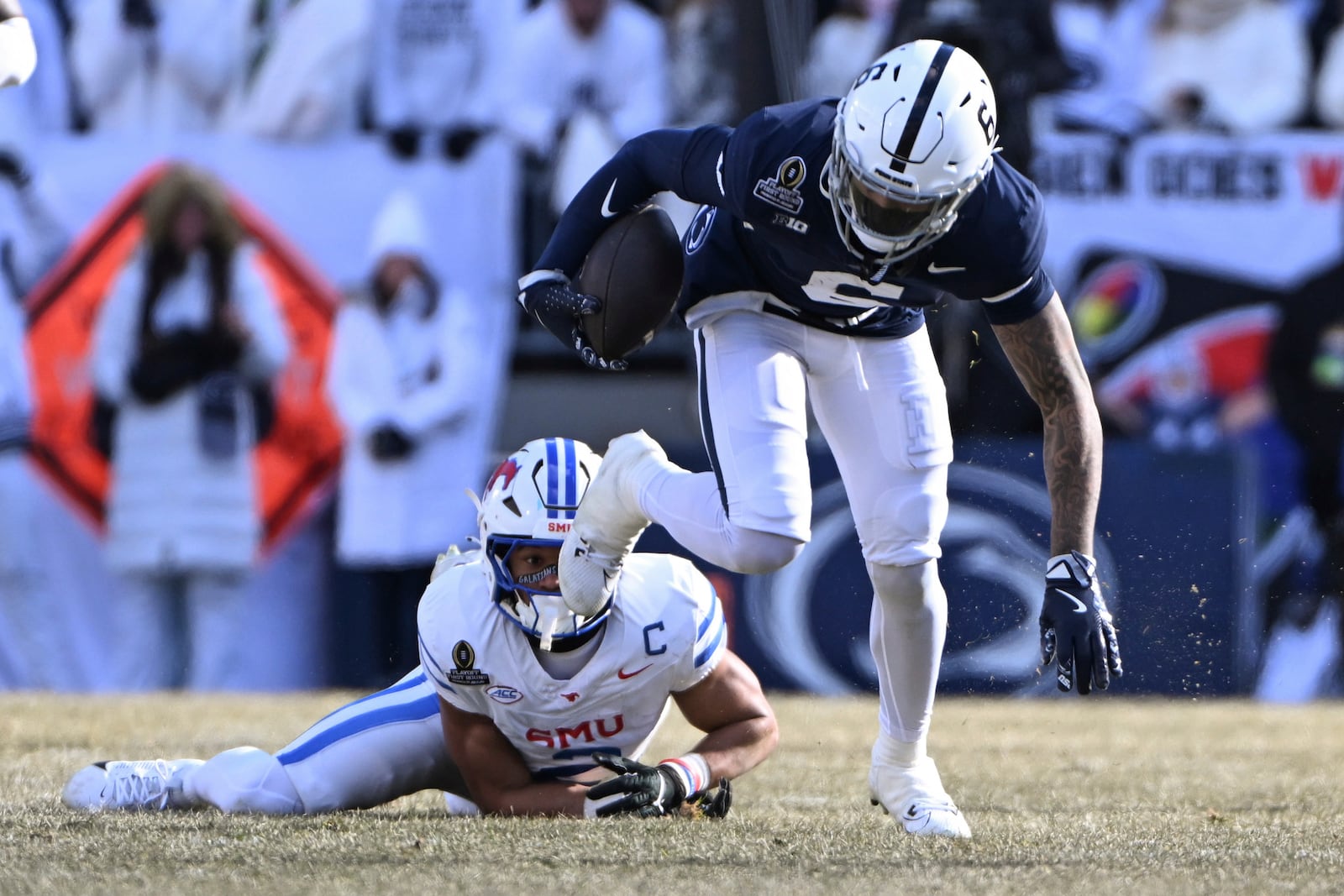 Penn State wide receiver Harrison Wallace III (6) breaks away from SMU safety Jonathan McGill during the first half in the first round of the College Football Playoff, Saturday, Dec. 21, 2024, in State College, Pa. (AP Photo/Barry Reeger)