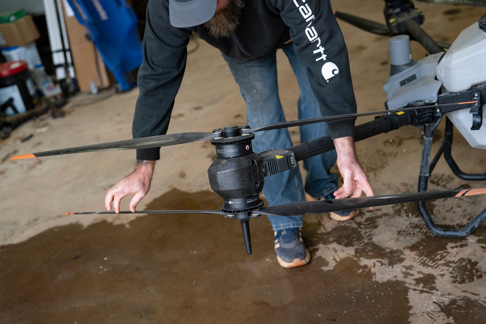 Russell Hedrick prepares a DJI drone to put crop cover on his farm, Tuesday, Dec. 17, 2024, in Hickory, N.C. (AP Photo/Allison Joyce)