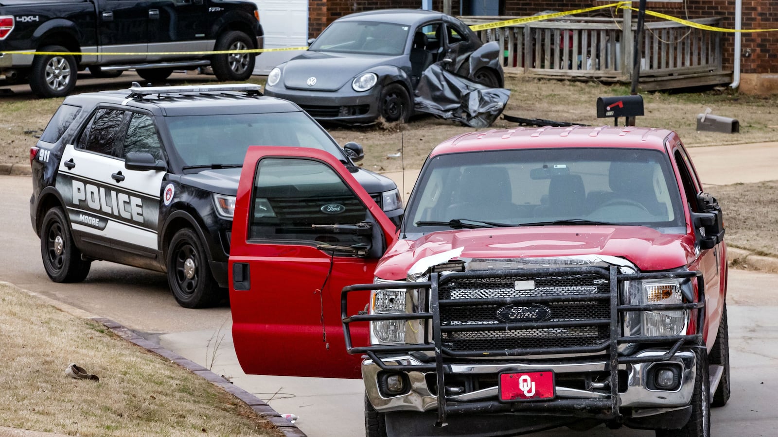 The Ford pickup truck driven by Max Townsend the afternoon of Feb. 3, 2020, is pictured near the scene in Moore, Okla., where he is accused of driving into a group of seven high school track runners, killing three of the students. Townsend, 57, lost his own son in an unrelated crash the day before, police say.