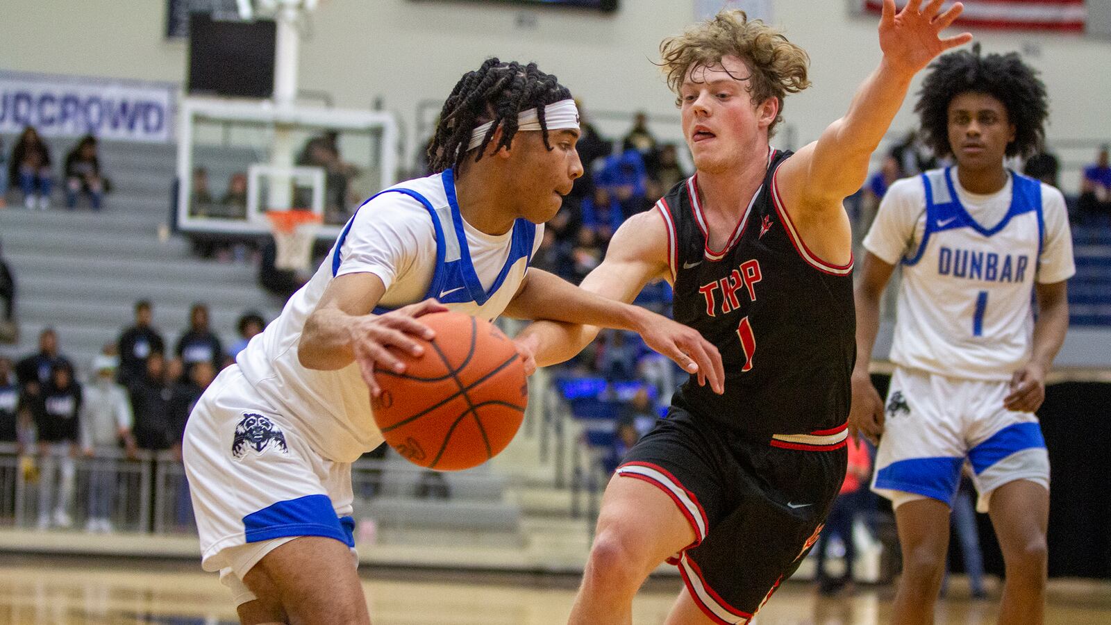 Dunbar's B.J. Hatcher drives on Tippecanoe's Liam Poronsky during Friday night's Division II sectional final at Trent Arena. Dunbar advanced to districts with a 47-38 victory. CONTRIBUTED/Jeff Gilbert