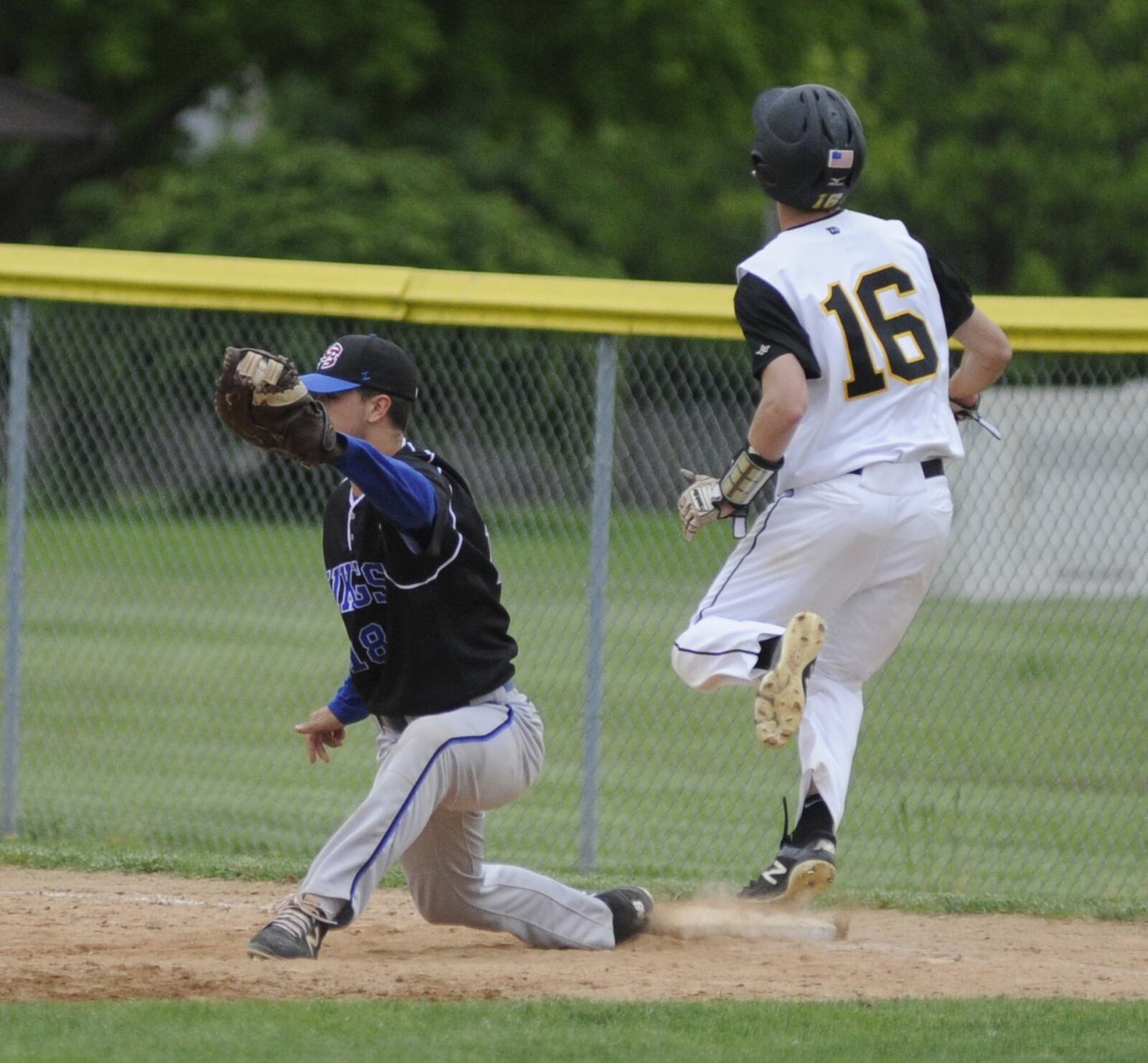 Miamisburg junior first baseman Jordon Boxer makes the put out of Centerville sophomore Ethan Muckerheide. Centerville defeated Miamisburg 4-0 in a D-I district semifinal baseball game at Butler on Tuesday, May 21, 2019. MARC PENDLETON / STAFF