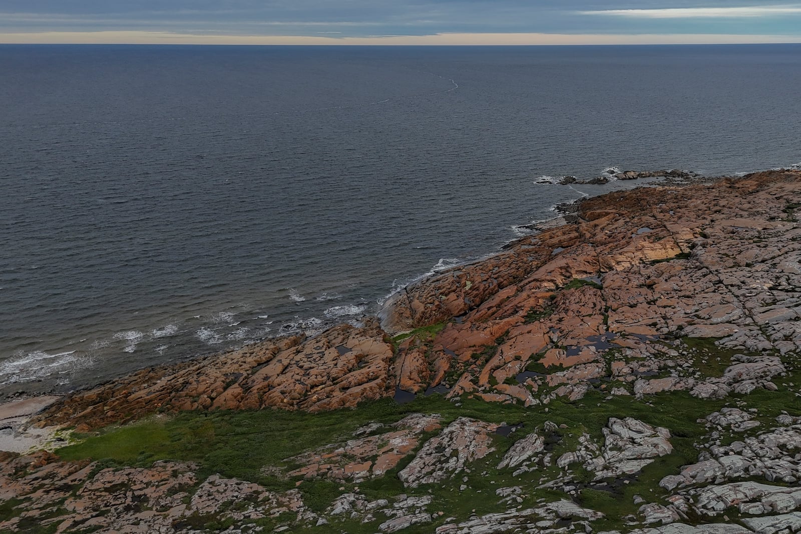 Waves from Hudson Bay crash onto shore, Wednesday, Aug. 7, 2024, in Churchill, Manitoba. (AP Photo/Joshua A. Bickel)