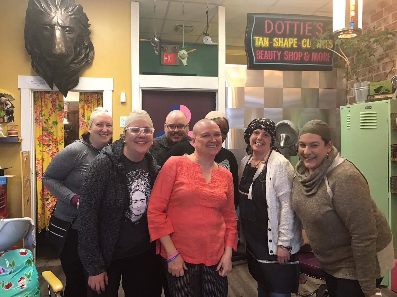 Friends wore bald head caps from Foy’s costume store during Kristen Wicker’s head-shaving shindig at Derailed Hair Salon in the Oregon District. Pictured left to right: Katie Wedell, Alexis Larsen, Anthony Shoemaker, Kristen Wicker, Amelia Robinson, Mindy Finch, Amy Forsthoefel. CONTRIBUTED