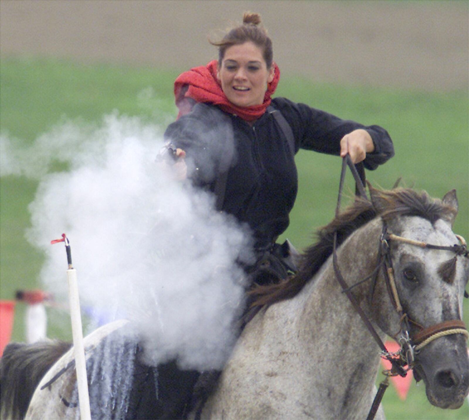 0729Annie-p2 Tiffany Richardson, Dayton, shoots out a balloon while on horse back during the 1st Ohio Cowboy Mounted Shooting Show held at the 38th Annual Annie Oakley Festival. CONTRIBUTED