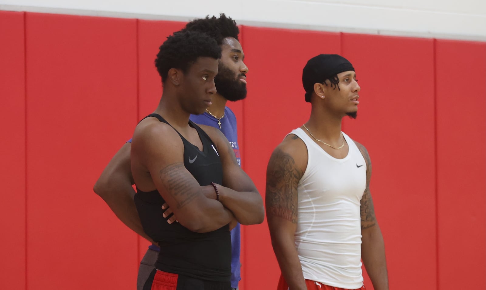 Former Flyers Jordan Sibert, Josh Cunningham and Darrell Davis (left to right) practice with the Red Scare for The Basketball Tournament on Tuesday, July 16, 2024, at the Cronin Center in Dayton. David Jablonski/Staff