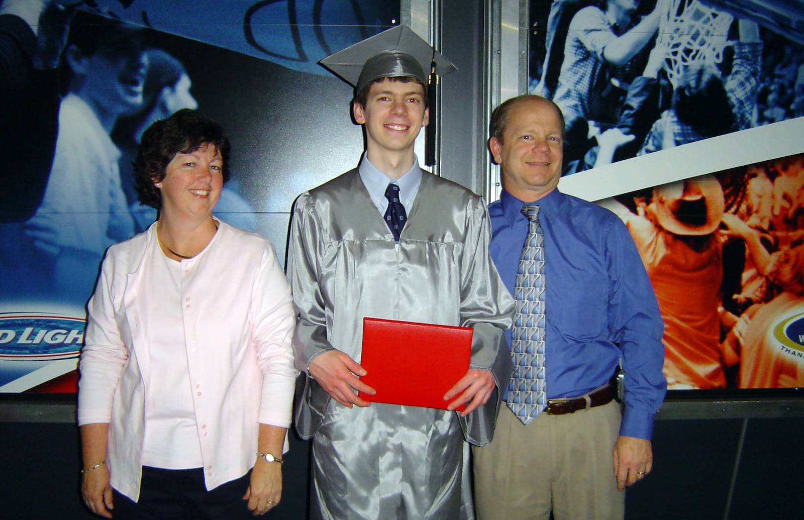 Rizer (center) with his parents Ann (L) and Ed (Right) at his graduation from Fairmont High School in Kettering - June 2002. Rizer went on to Sinclair Community College to study technology and earned an associate degree in applied science. 