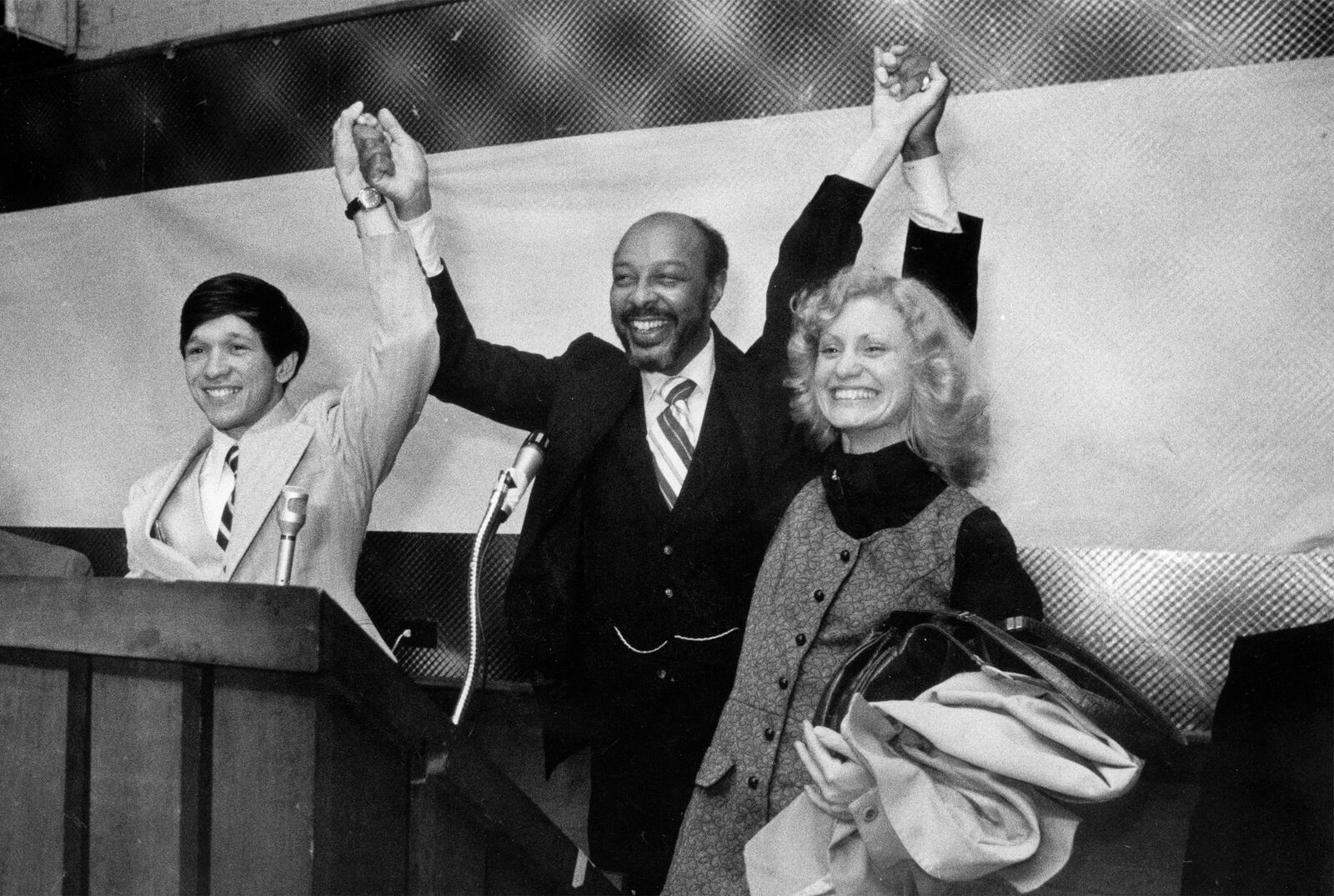 FILE - In this November 1977, file photo, Dennis Kucinich, his wife, Sandy, right, and Rep. Louis Stokes, D-Ohio, raise their arms at the Party Center in Cleveland. Stokes, a 15-term Ohio congressman who took on tough assignments looking into assassinations and scandals, died late Tuesday, Aug. 18, 2015. Stokes was 90. (The Plain Dealer via AP, File) MANDATORY CREDIT; NO SALES