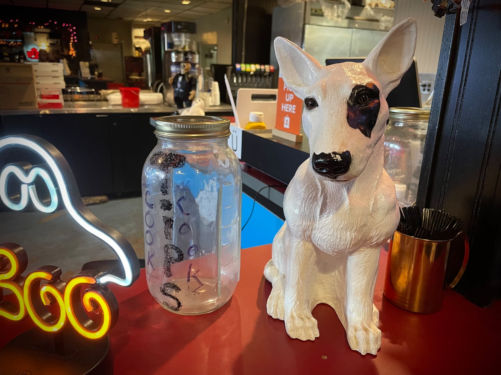 Mort’s East, a new neighborhood tavern, is open at 2866 S. Dixie Drive in Kettering. Pictured is the figurine that was found at the bar and used in the new logo. NATALIE JONES/STAFF