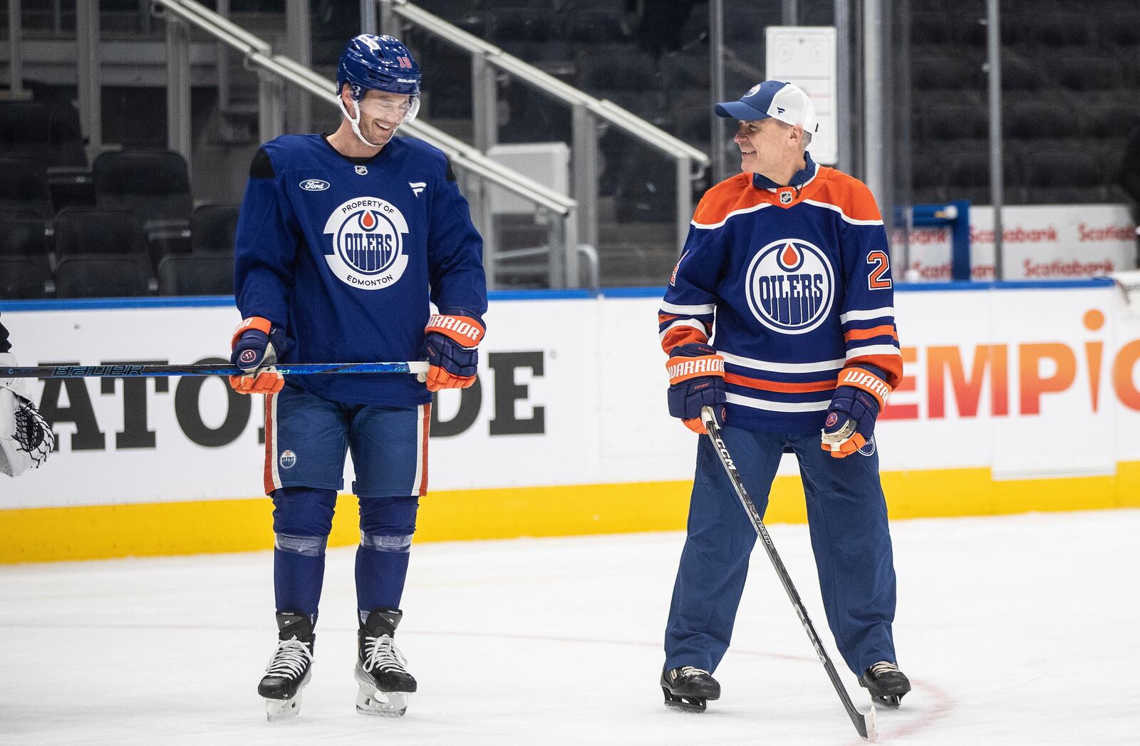 Canadian Prime Minister Mark Carney skates with Derek Ryan (10)at the NHL hockey team's practice during a visit to Edmonton, Alberta, Thursday, March 20, 2025. (Jason Franson/The Canadian Press via AP)