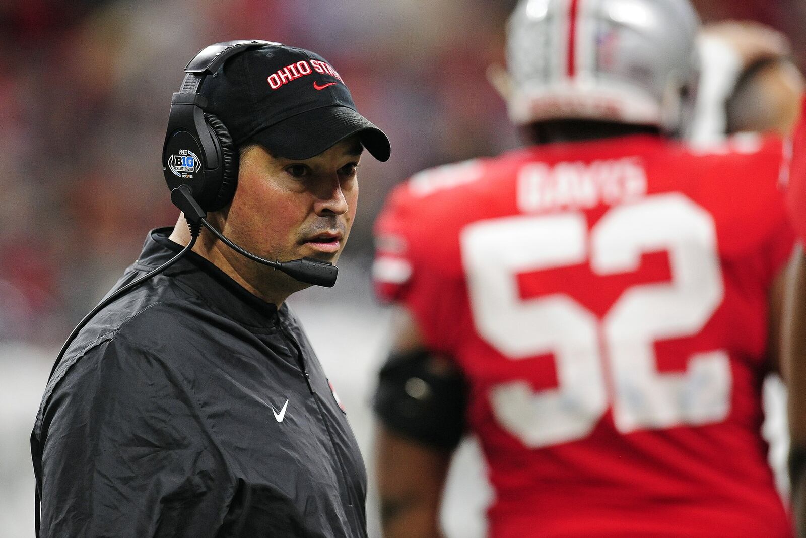 INDIANAPOLIS, IN - DECEMBER 01: Ohio State Buckeyes Offensive Coordinator Ryan Day steps into the team huddle during a timeout in the Big Ten Conference Championship college football game between the Northwestern Wildcats and the Ohio State Buckeyes on December 1, 2018, at Lucas Oil Stadium in Indianapolis, Indiana. (Photo by Michael Allio/Icon Sportswire via Getty Images)