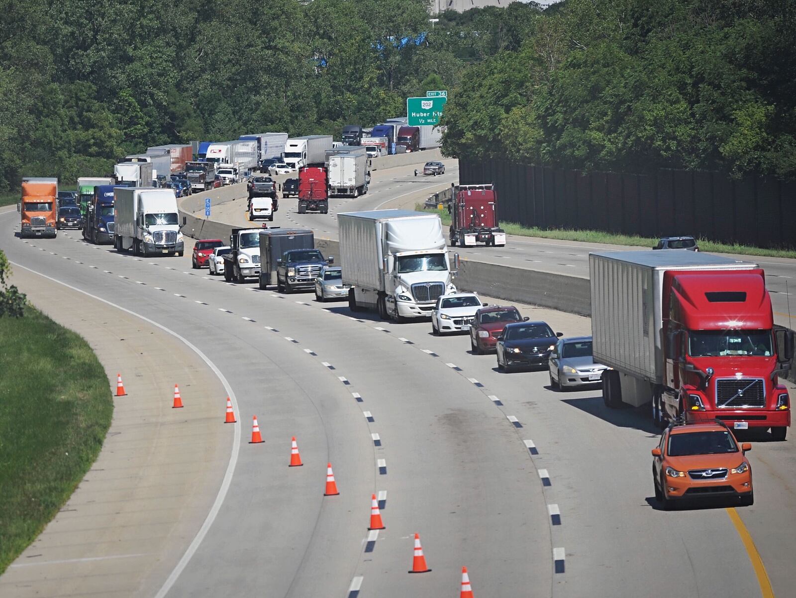 Westbound Interstate 70 traffic was backed up for miles after a vehicle pursued by the Ohio State Highway Patrol crashed into the back of a Huber Heights police cruiser near the Bridgewater Road overpass on Thursday, Aug. 20, 2020.