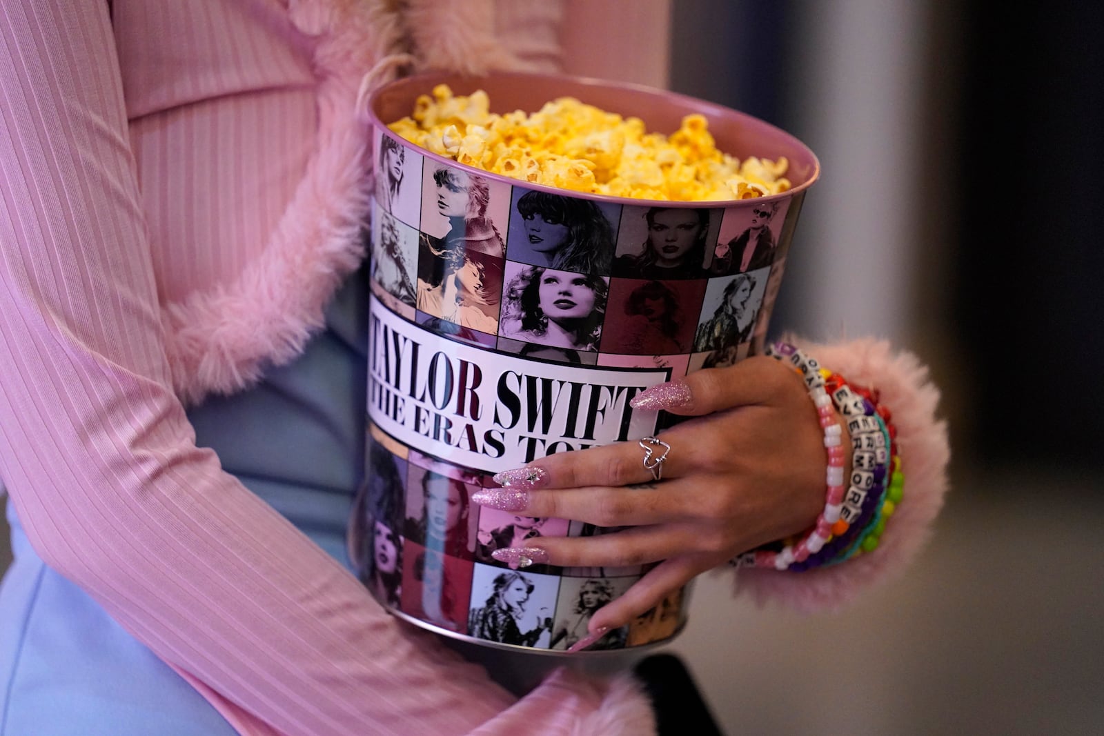 A fan attends the world premiere of the concert film "Taylor Swift: The Eras Tour" on Wednesday, Oct. 11, 2023, at AMC The Grove 14 in Los Angeles. (AP Photo/Chris Pizzello)