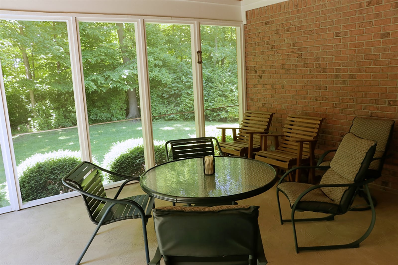 Double over-sized patio doors open from the breakfast room to a screen-enclosed porch that has a glass door, which opens to the shaded patio. CONTRIBUTED PHOTO BY KATHY TYLER